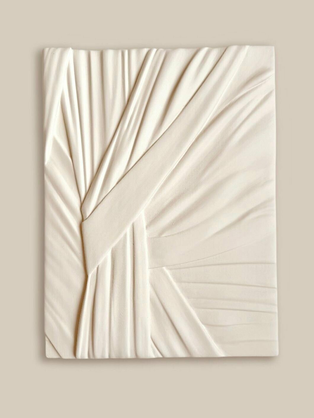 Plaster panel on the wall for interior decor, 40x30 cm